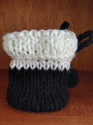 Two‑Colour Hand‑Knitted Tech Pod — Black & White Drawstring Pouch Two‑Colour Hand‑Knitted Tech Pod — Black & White Drawstring Pouch